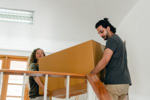 Volunteer helping move furniture